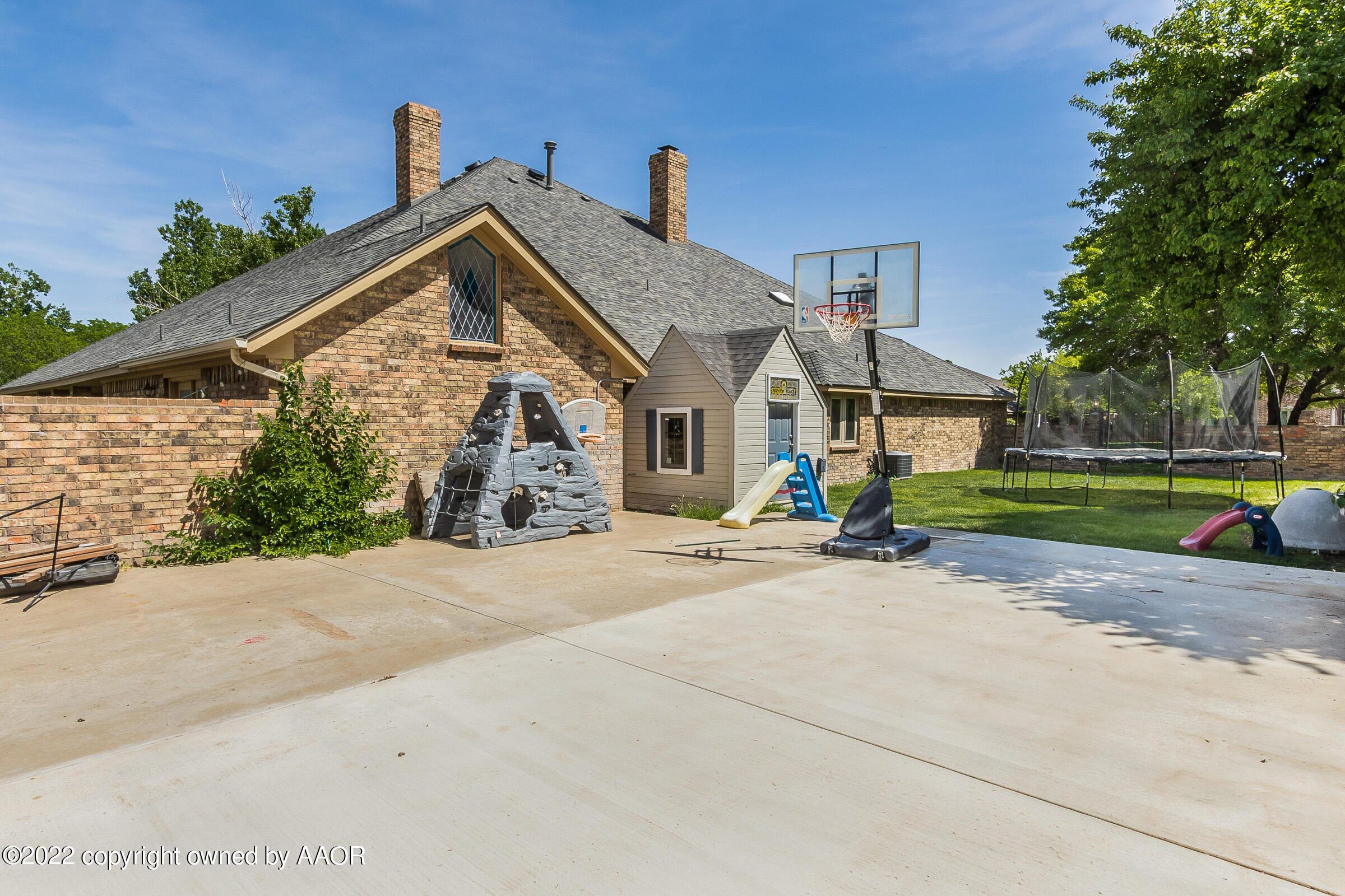 6600 Stoneham Drive Amarillo, TX 79109 - Photo 37 of 43 a front view of a house with a yard and garage