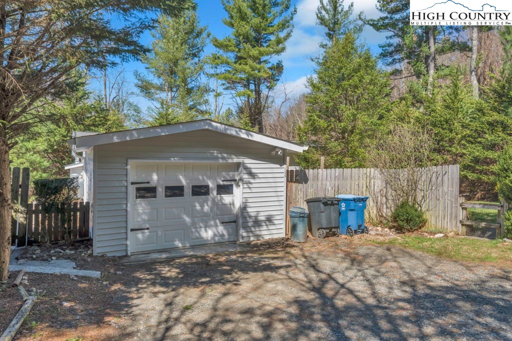 156 Olancha Avenue Boone, NC 28607 - Photo 2 of 23 a front view of a house with a yard and garage
