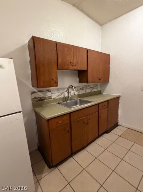 521 North Decatur Boulevard, Unit B Las Vegas, NV 89107 - Photo 6 of 17 Functional kitchen with ample cabinet space, offering practical living for any resident.