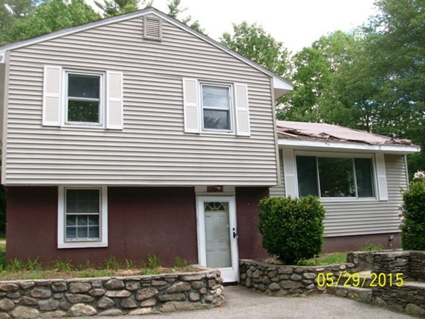 847 Patriots Road Templeton, MA 01468 - Photo 1 of 10 a front view of a house with a garage