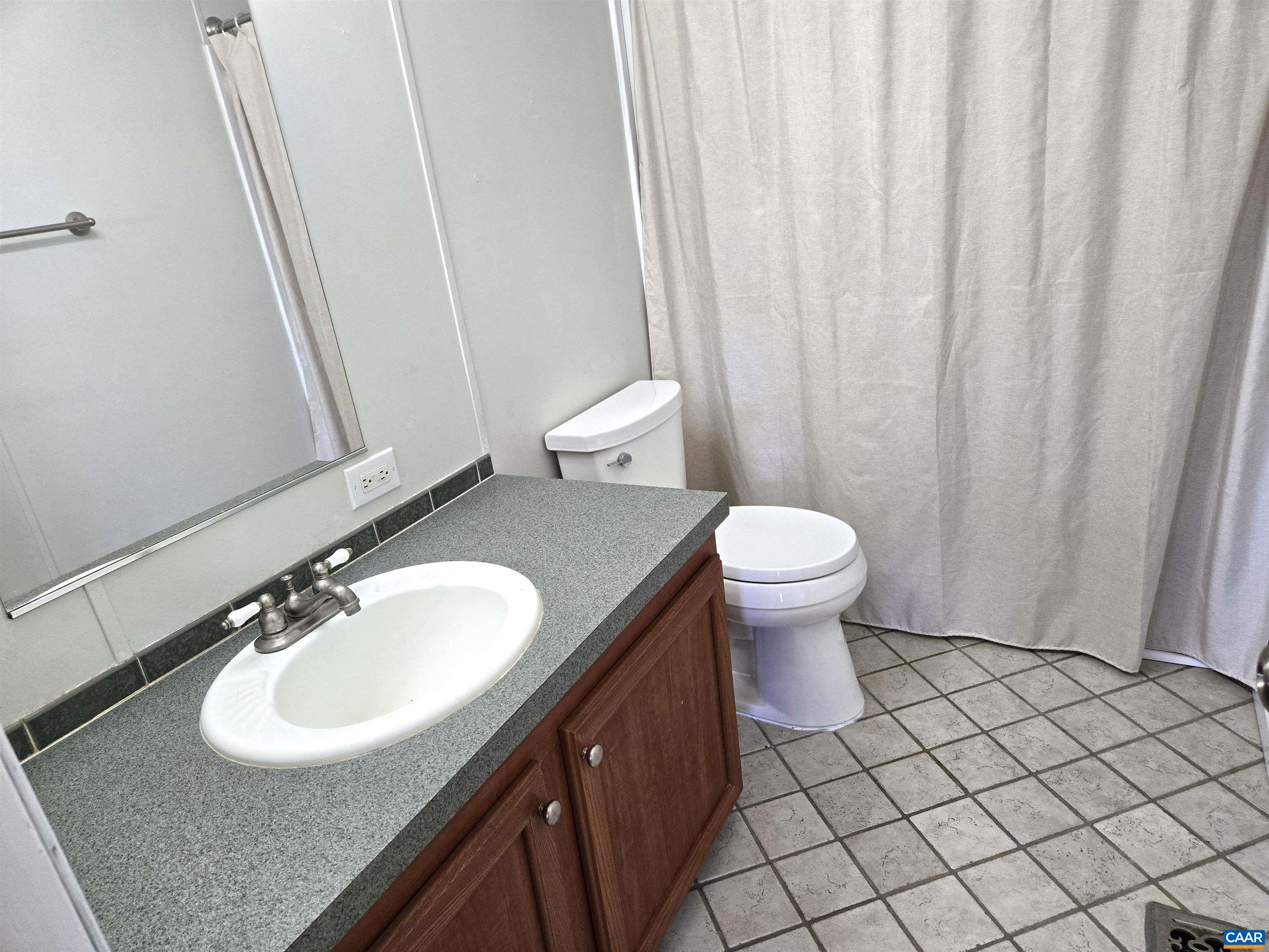 3691 Meherrin Road Meherrin, VA 23954 - Photo 19 of 75 a bathroom with a sink a toilet and a mirror