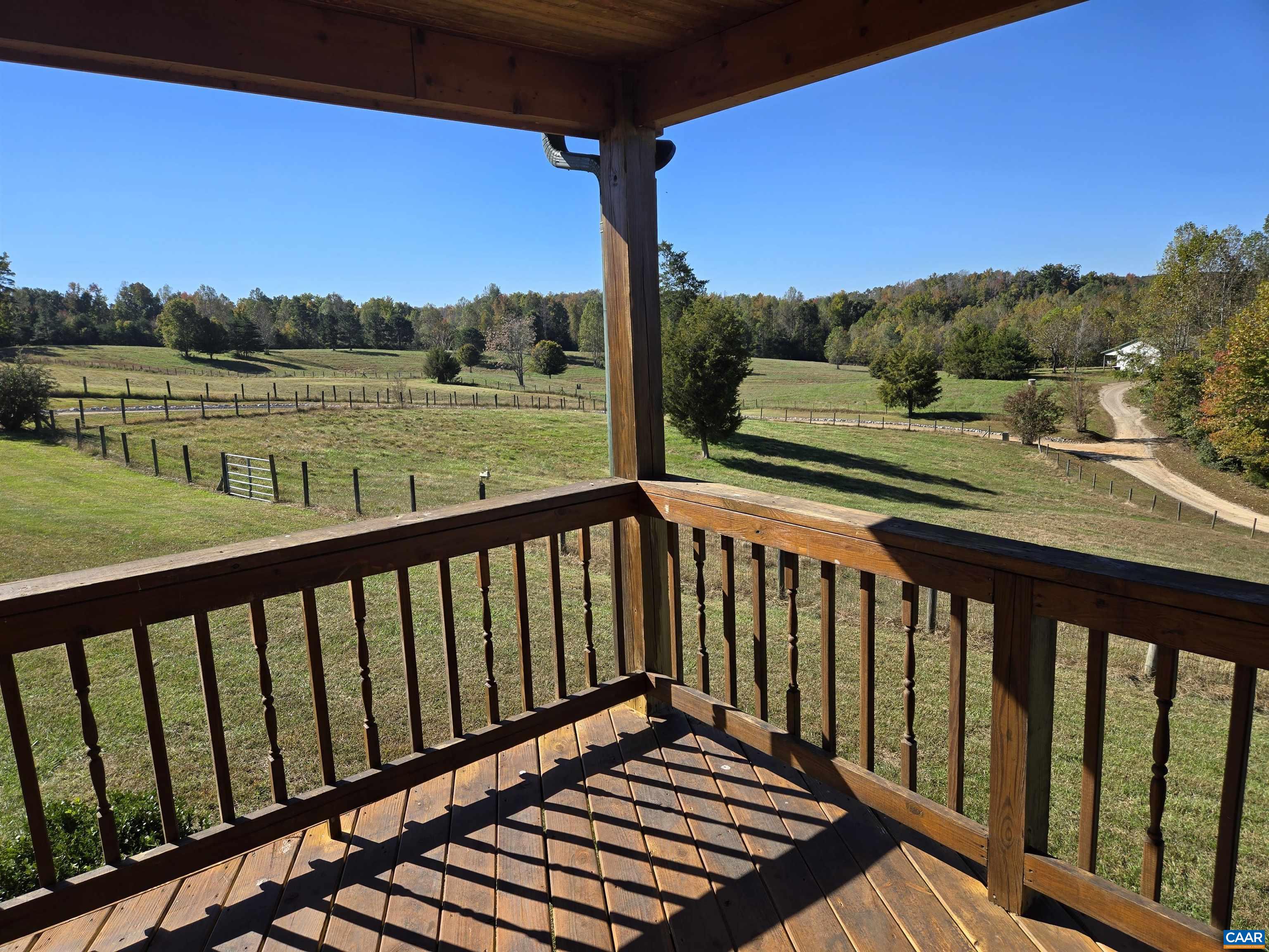 3691 Meherrin Road Meherrin, VA 23954 - Photo 29 of 75 a view of a balcony with wooden floor & fence