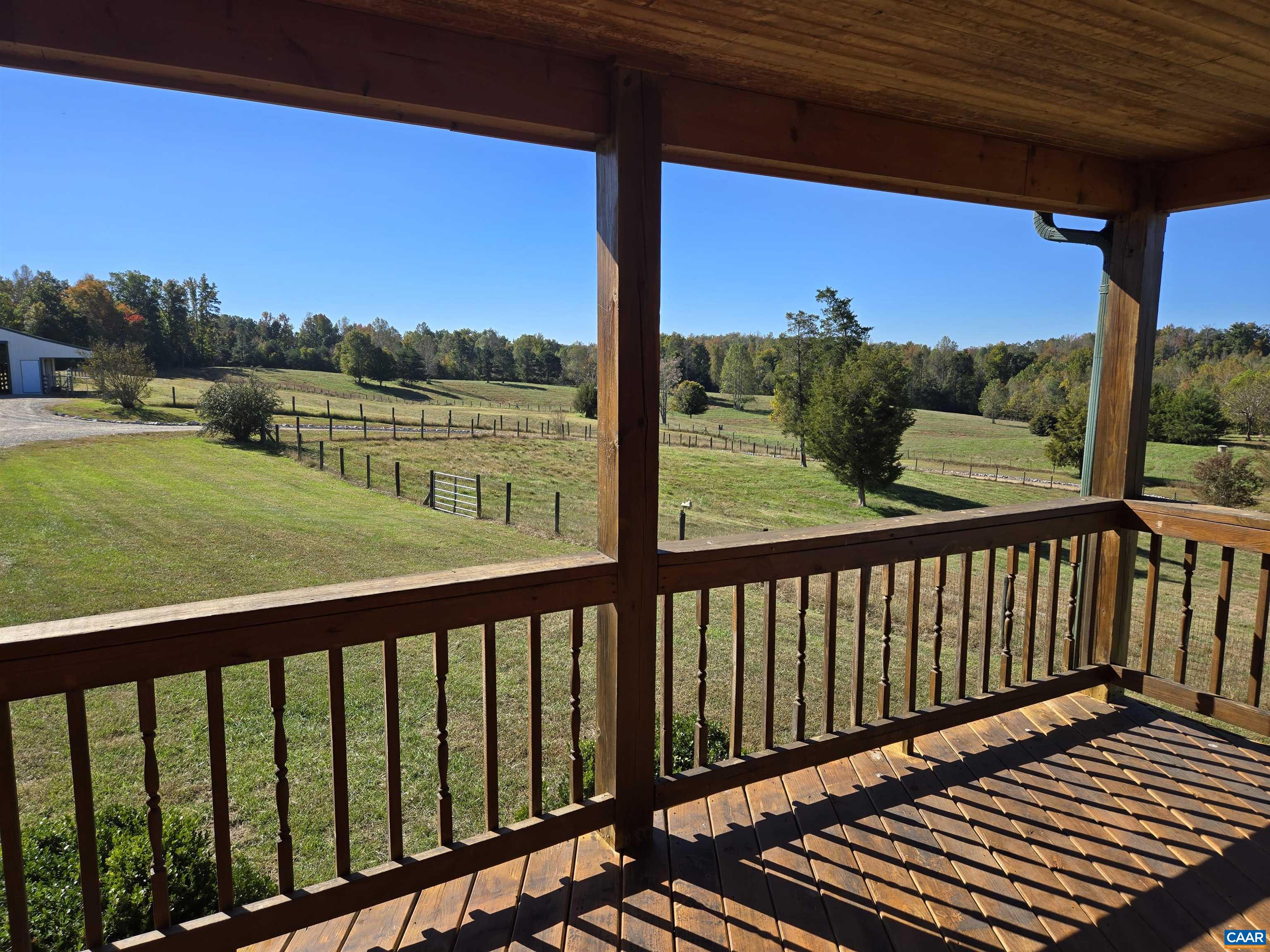 3691 Meherrin Road Meherrin, VA 23954 - Photo 30 of 75 a view of a balcony with wooden floor & fence