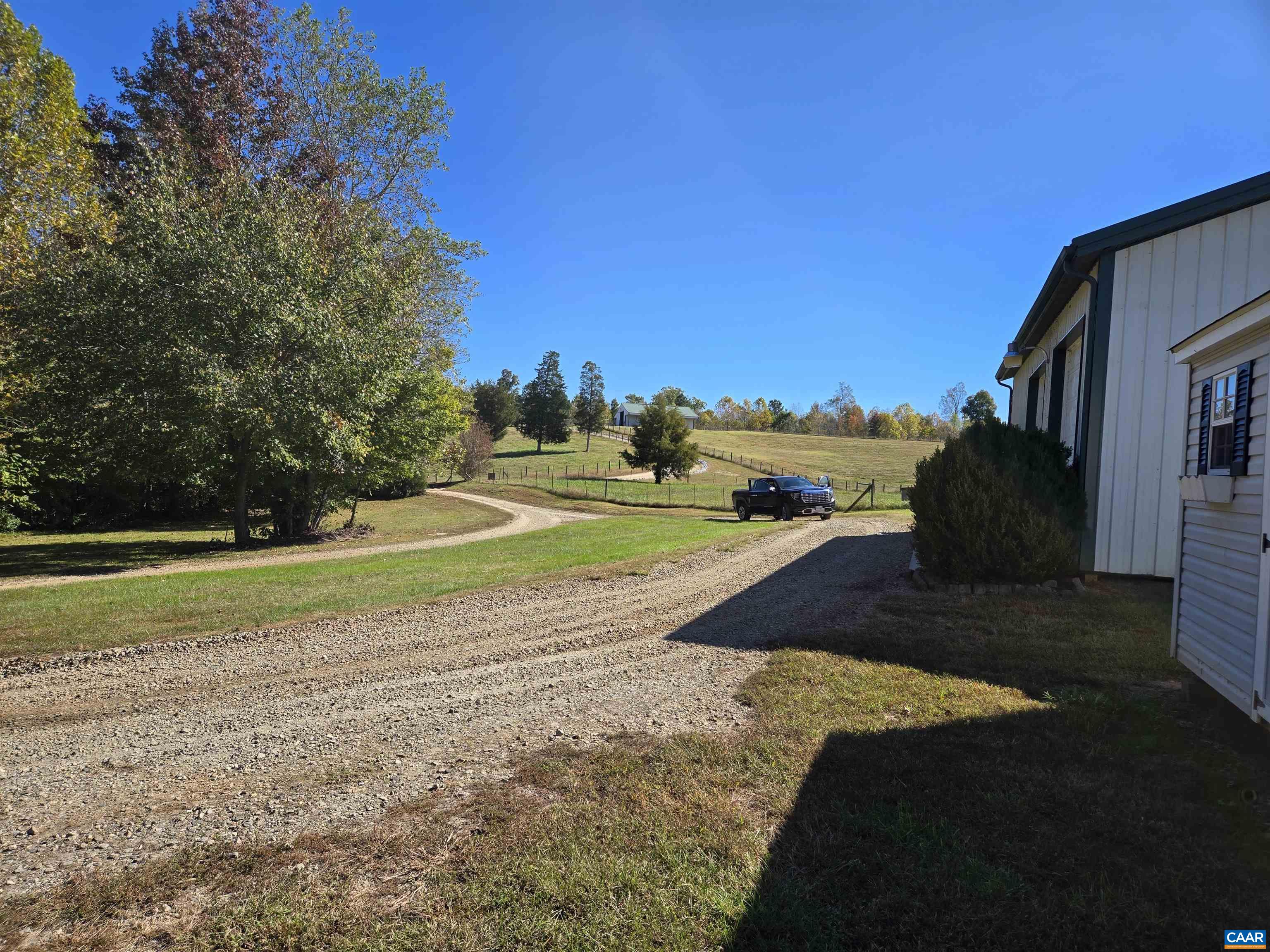 3691 Meherrin Road Meherrin, VA 23954 - Photo 50 of 75 a view of a house with a yard and sitting area