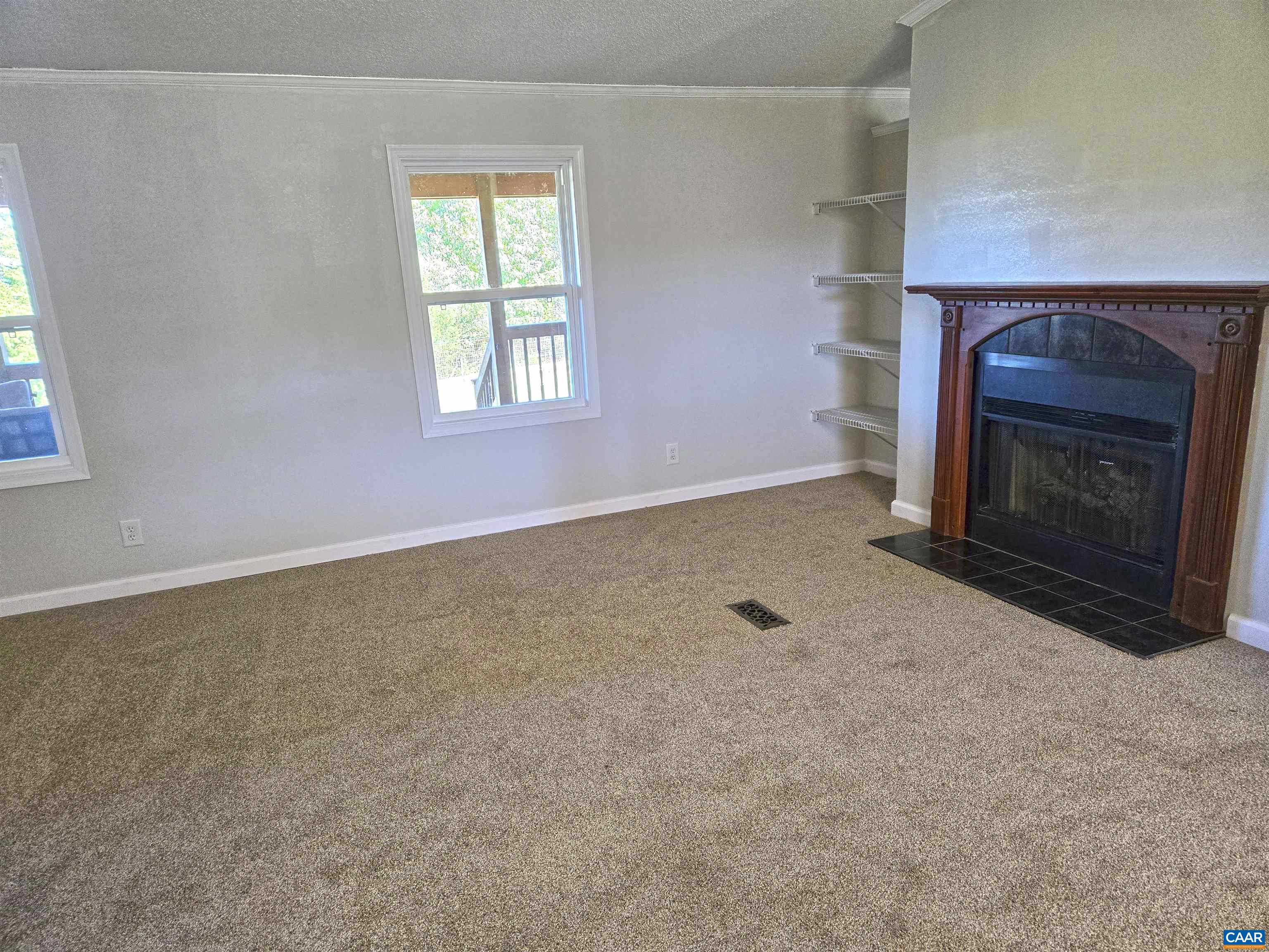 3691 Meherrin Road Meherrin, VA 23954 - Photo 6 of 75 a view of empty room with a fireplace