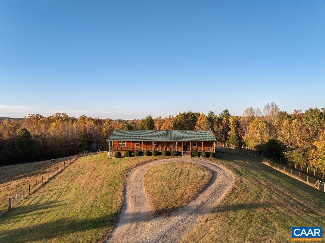 3691 Meherrin Road Meherrin, VA 23954 - Photo 71 of 75 a view of a swimming pool with a table under an umbrella