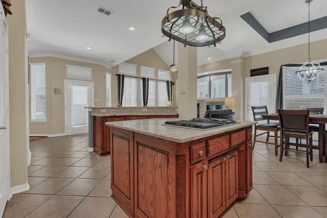 a kitchen with a counter space a sink appliances and cabinets