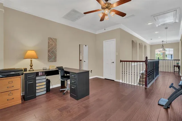 a open kitchen with stainless steel appliances granite countertop a stove a sink dishwasher and a dining table with wooden floor