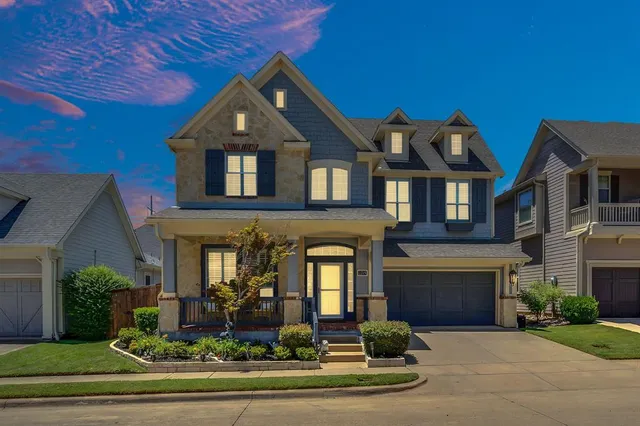 front view of a house with a potted plant