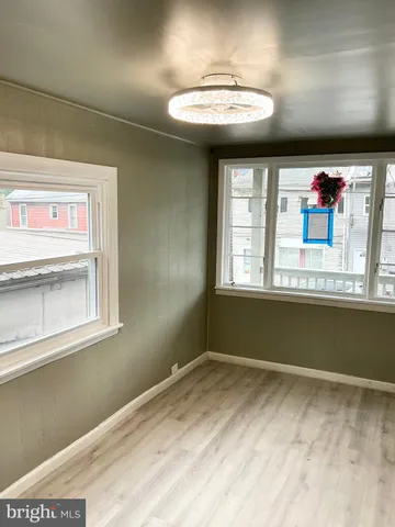 a view of a room with a large window