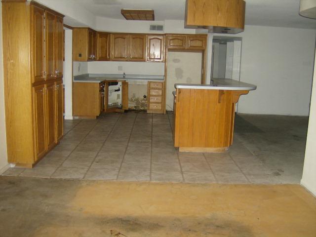 3444 West Calavar Road Phoenix, AZ 85053 - Photo 2 of 6 great room to kitchen