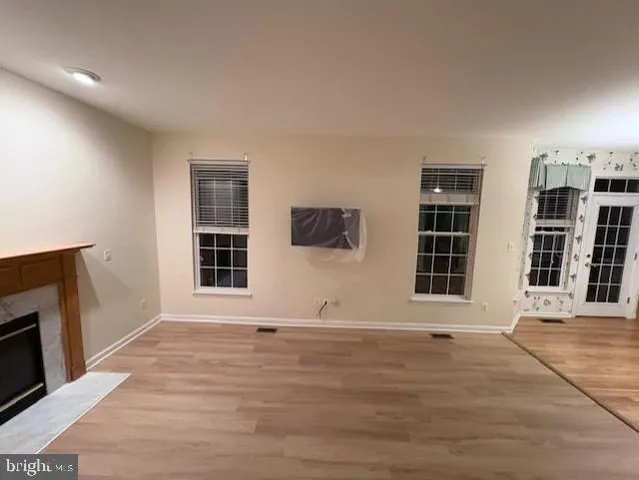 a view of empty room with windows