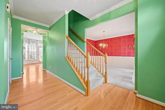 a view of an entryway with wooden floor