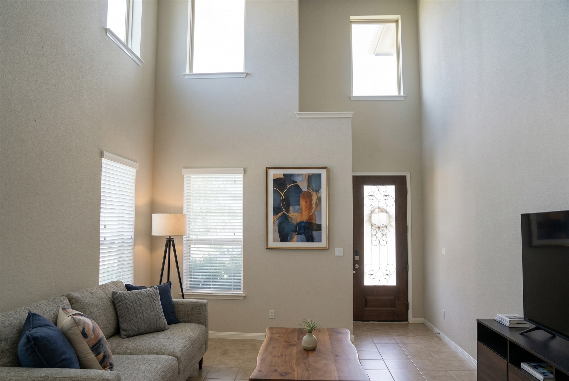 19028 Quebrada Drive Pflugerville, TX 78660 - Photo 9 of 36 a living room with furniture and a flat screen tv