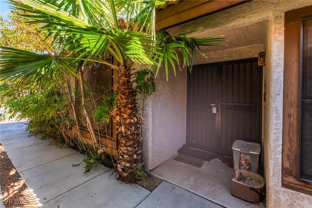 6513 Deadwood Road Las Vegas, NV 89108 - Photo 5 of 34 View of exterior entry featuring stucco siding