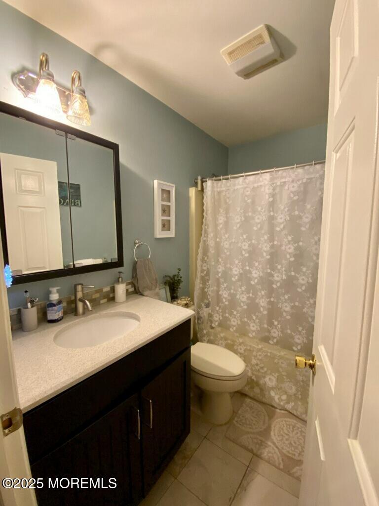 906 16th Avenue, Unit FRONT Belmar, NJ 07719 - Photo 8 of 10 a bathroom with a sink and a mirror