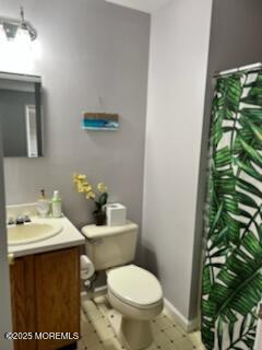 906 16th Avenue, Unit FRONT Belmar, NJ 07719 - Photo 9 of 10 a bathroom with a sink a toilet and a mirror