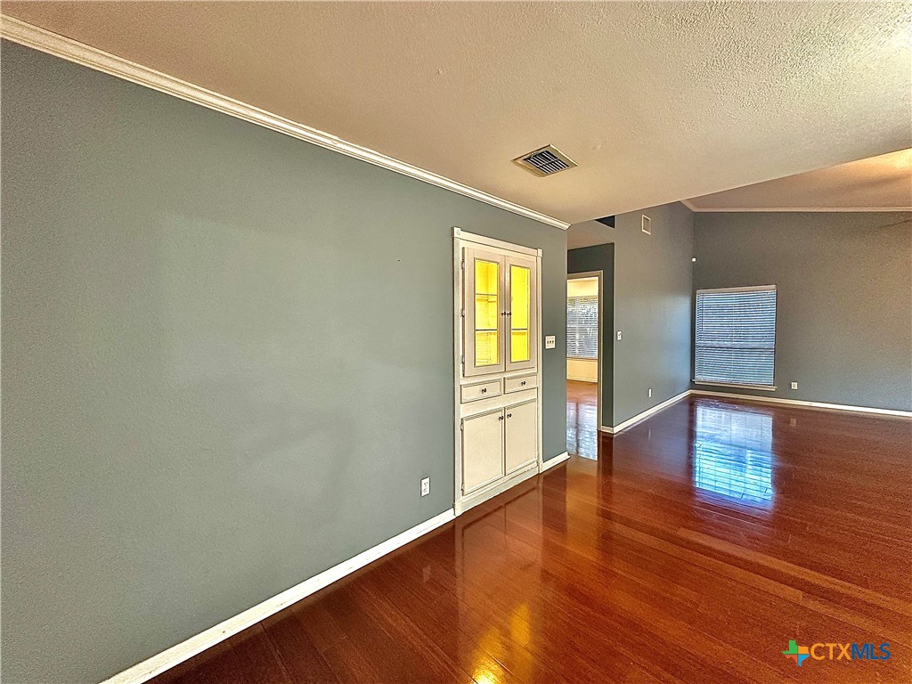 120 Andover Street Victoria, TX 77904 - Photo 11 of 40 a view of empty room with wooden floor