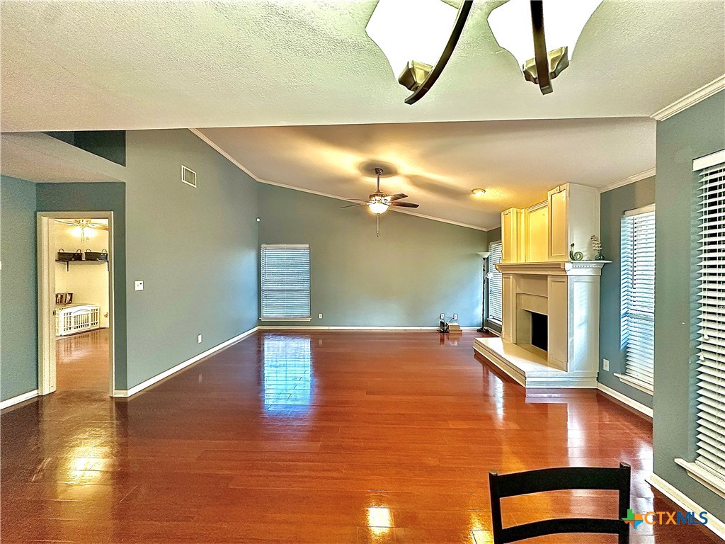 120 Andover Street Victoria, TX 77904 - Photo 12 of 40 a view of an empty room with window and wooden floor