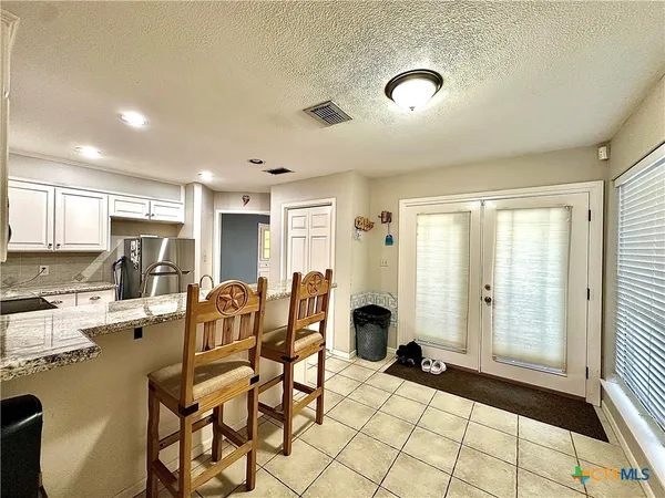 a view of a living room and dining room
