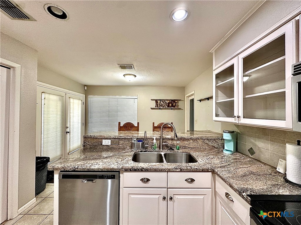 120 Andover Street Victoria, TX 77904 - Photo 23 of 40 a kitchen with a sink stove and cabinets