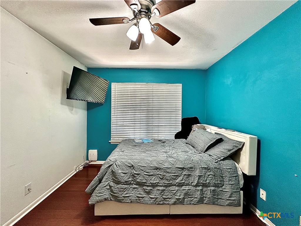 120 Andover Street Victoria, TX 77904 - Photo 31 of 40 a bedroom with a bed and a ceiling fan