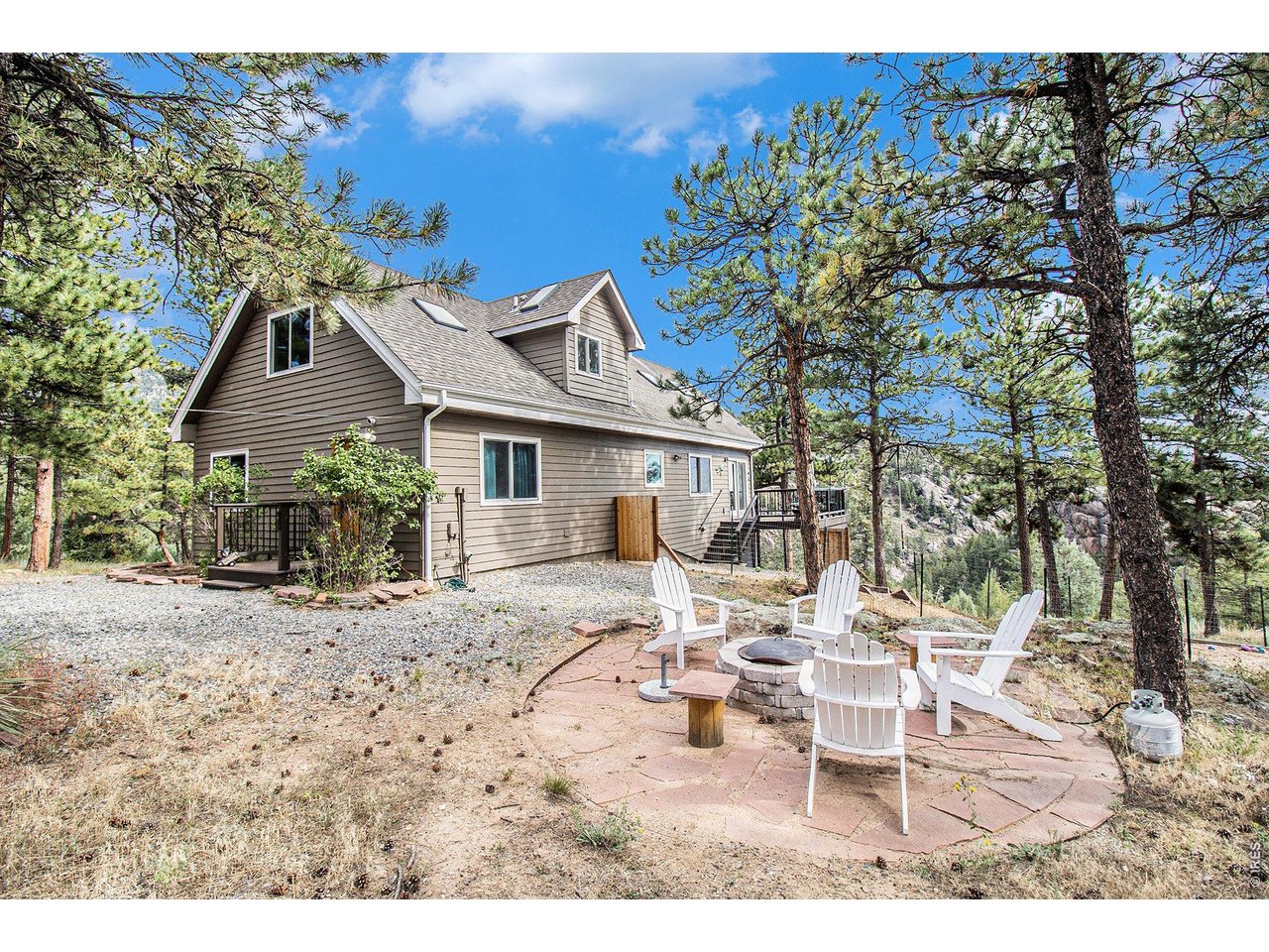 270 Choctaw Road Lyons, CO 80540 - Photo 23 of 32 Peaceful fire pit area surrounded by nature