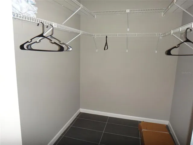 a bedroom with two beds and a window