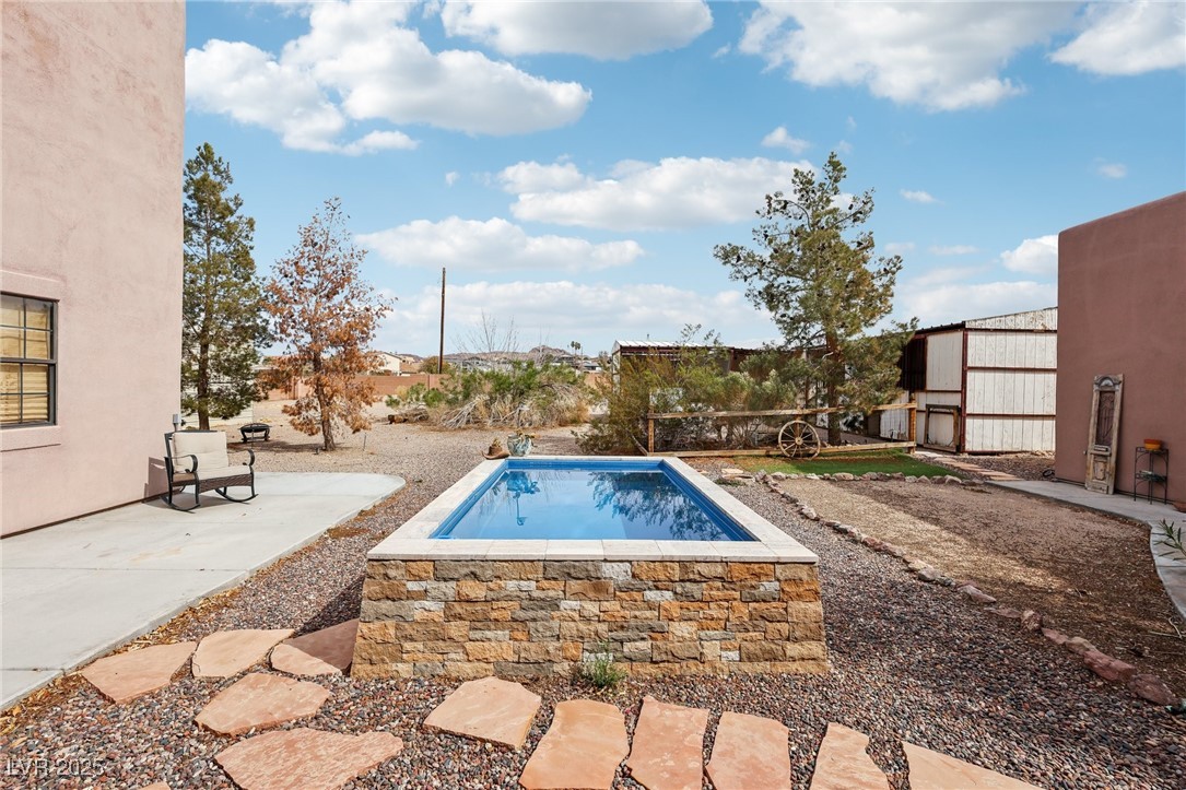 519 North Racetrack Road Henderson, NV 89015 - Photo 75 of 98 View of swimming pool with a patio area