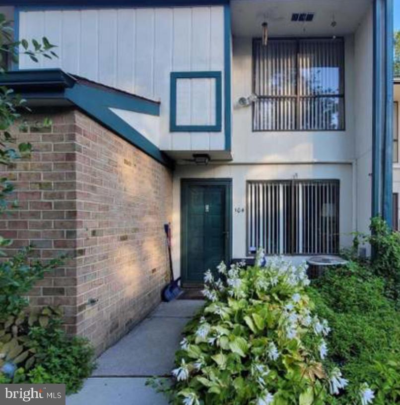 104 Timber Creek Road Clementon, NJ 08021 - Photo 1 of 1 a view of a house with large windows and flower plants