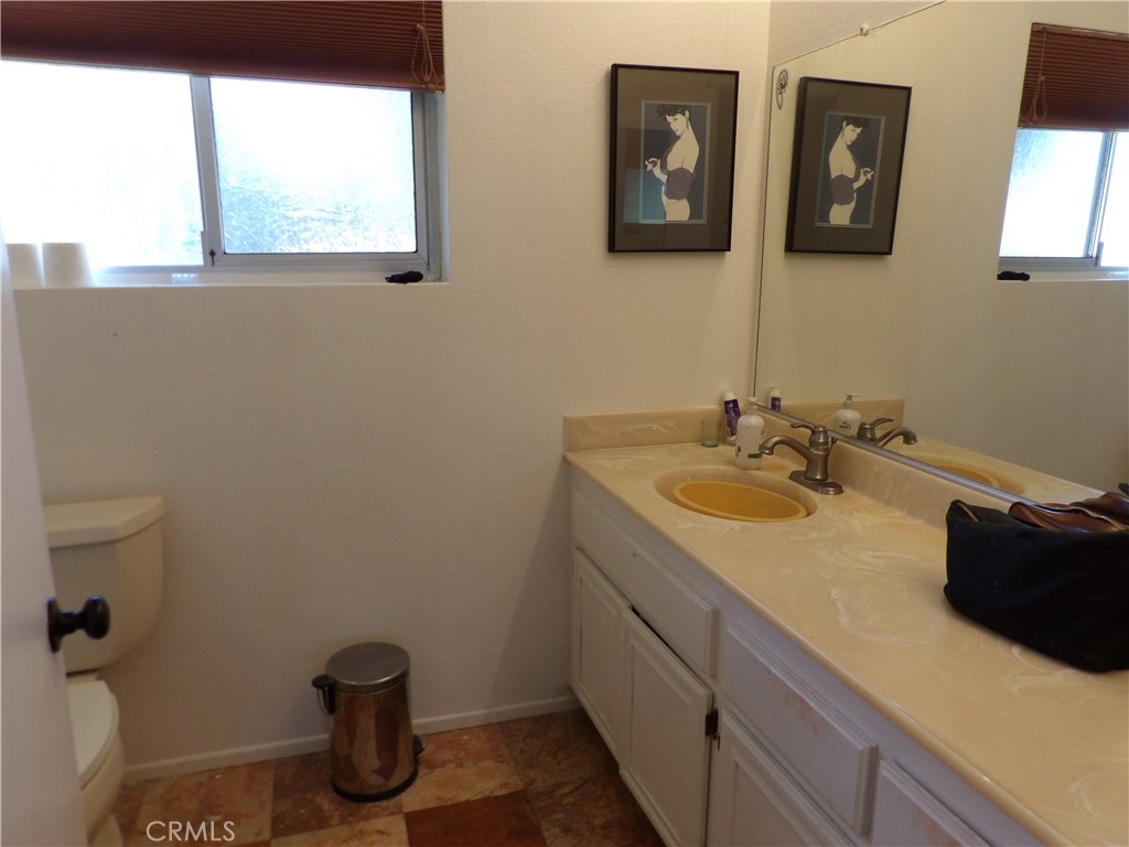 19140 Lahey Street, Unit 4 Porter Ranch, CA 91326 - Photo 13 of 37 a bathroom with a sink and a mirror