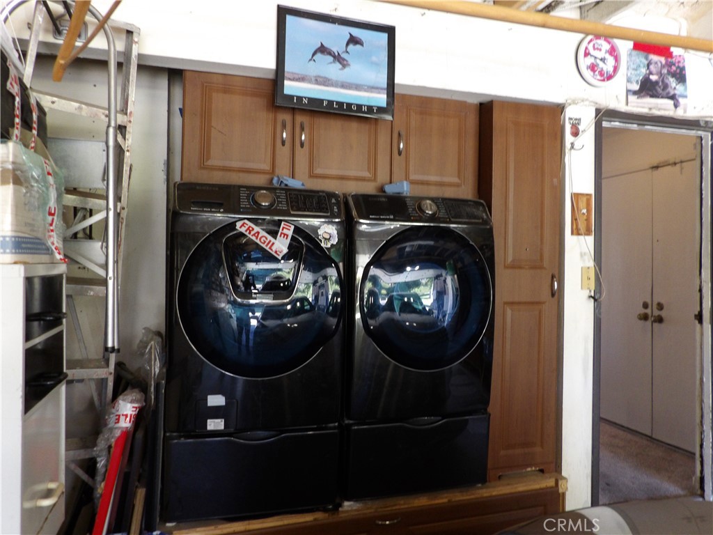 19140 Lahey Street, Unit 4 Porter Ranch, CA 91326 - Photo 18 of 37 a utility room with dryer and washer