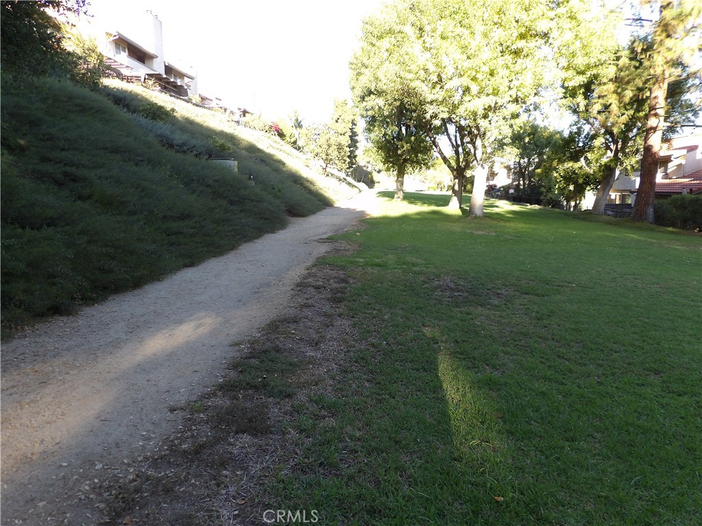 19140 Lahey Street, Unit 4 Porter Ranch, CA 91326 - Photo 32 of 37 a view of grassy field with trees