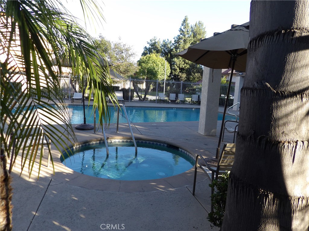 19140 Lahey Street, Unit 4 Porter Ranch, CA 91326 - Photo 35 of 37 a view of balcony with two chairs and a fire pit