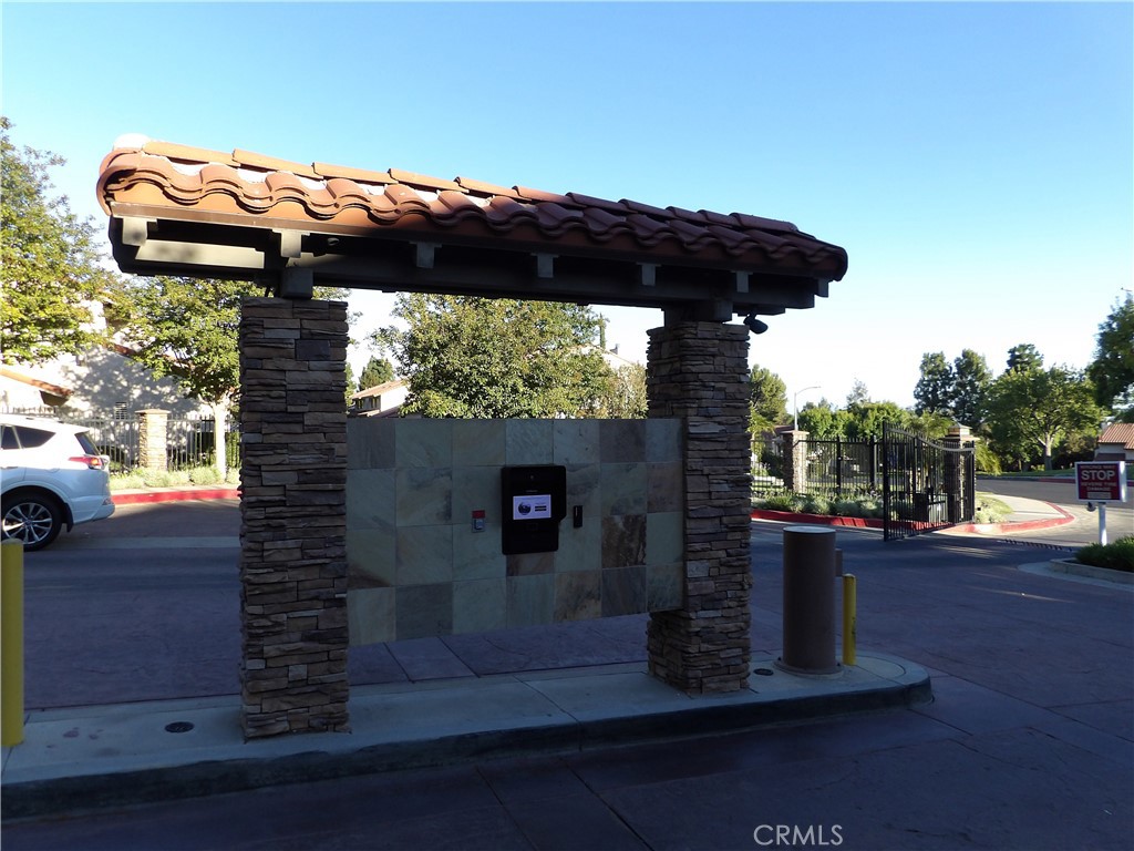 19140 Lahey Street, Unit 4 Porter Ranch, CA 91326 - Photo 36 of 37 a view of a porch with furniture and a yard
