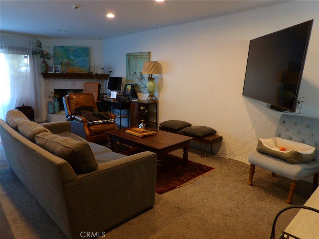 19140 Lahey Street, Unit 4 Porter Ranch, CA 91326 - Photo 4 of 37 a living room with furniture and a flat screen tv
