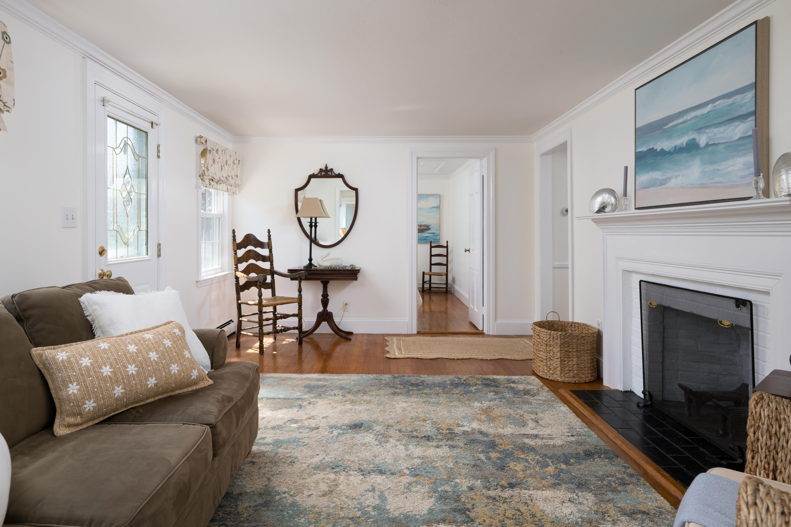 111 Lewis Road West Yarmouth, MA 02673 - Photo 8 of 43 a living room with furniture a fireplace and a large window