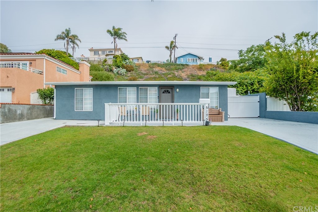 5125 Zakon Road Torrance, CA 90505 - Photo 1 of 1 a front view of a house with a garden and plants