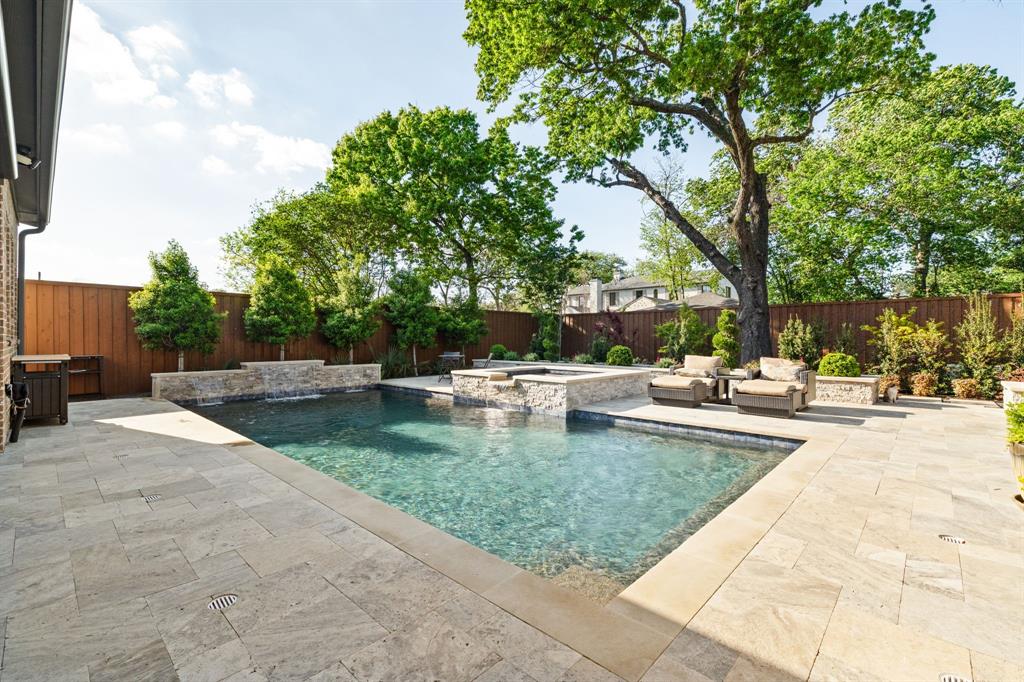 5019 Lark Lane Dallas, TX 75209 - Photo 22 of 32 a view of a swimming pool with a patio