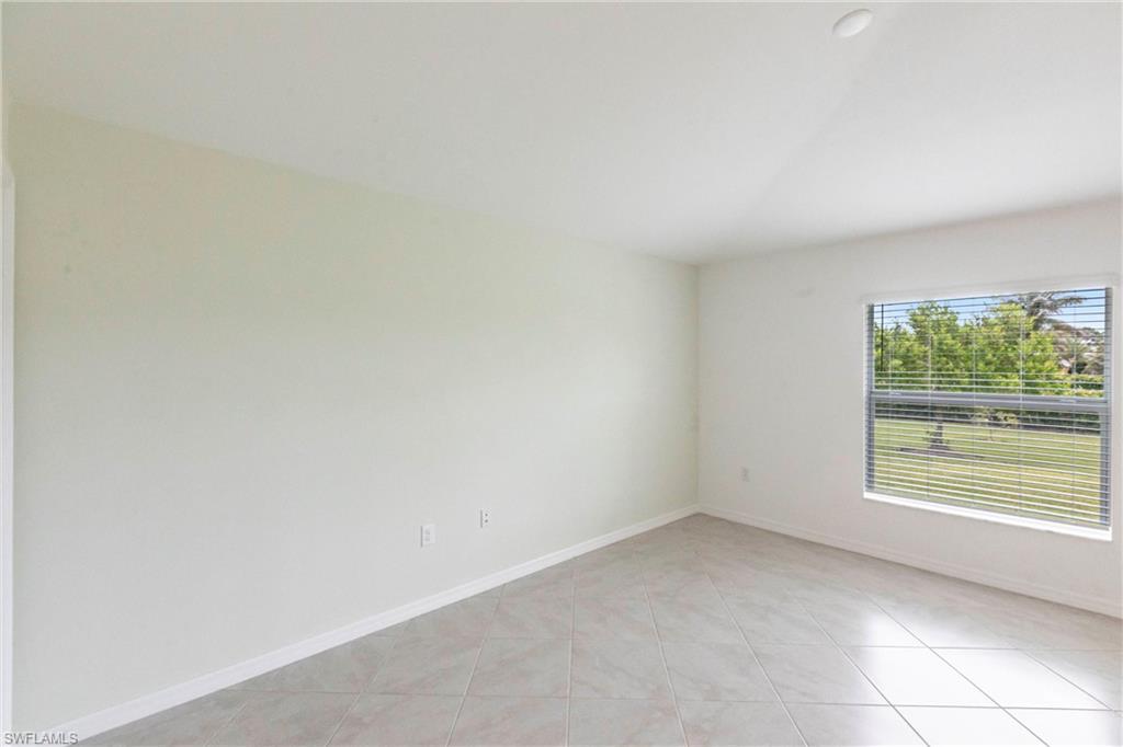 358 Pembroke Street Lehigh Acres, FL 33974 - Photo 14 of 45 an empty room with a window