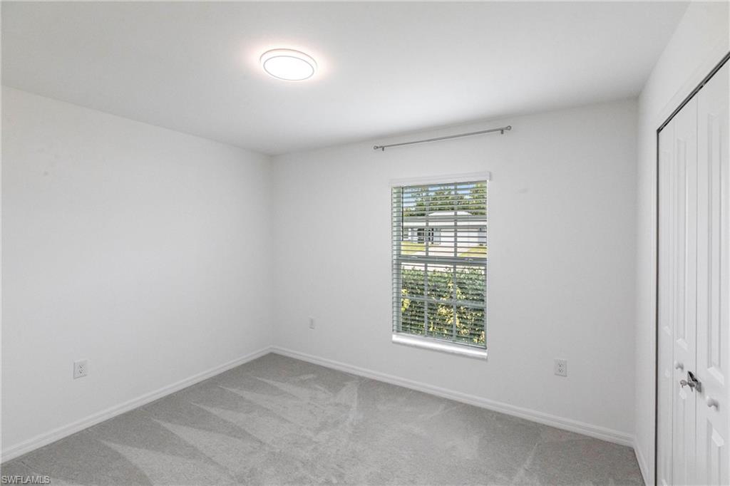 358 Pembroke Street Lehigh Acres, FL 33974 - Photo 15 of 45 an empty room with a window
