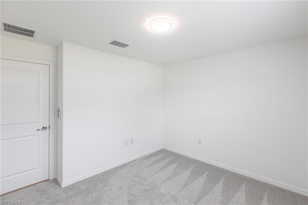 358 Pembroke Street Lehigh Acres, FL 33974 - Photo 16 of 45 a view of an empty room