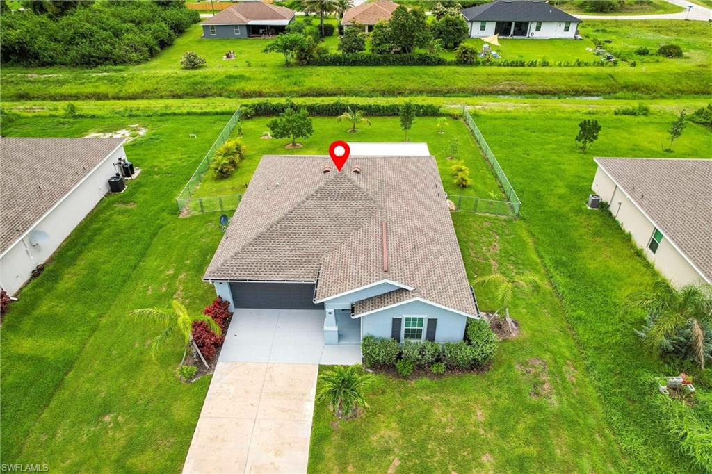 358 Pembroke Street Lehigh Acres, FL 33974 - Photo 2 of 45 an aerial view of a house with big yard