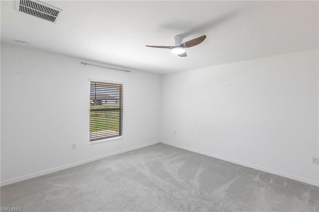 358 Pembroke Street Lehigh Acres, FL 33974 - Photo 24 of 45 an empty room with a window