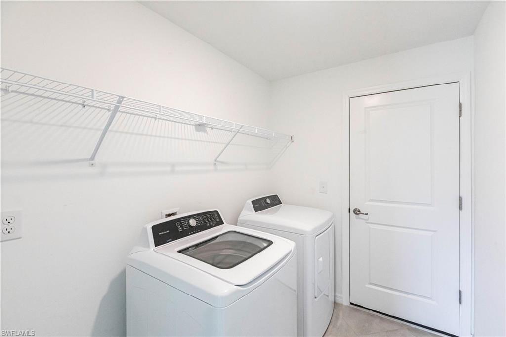 358 Pembroke Street Lehigh Acres, FL 33974 - Photo 30 of 45 a utility room with dryer and washer
