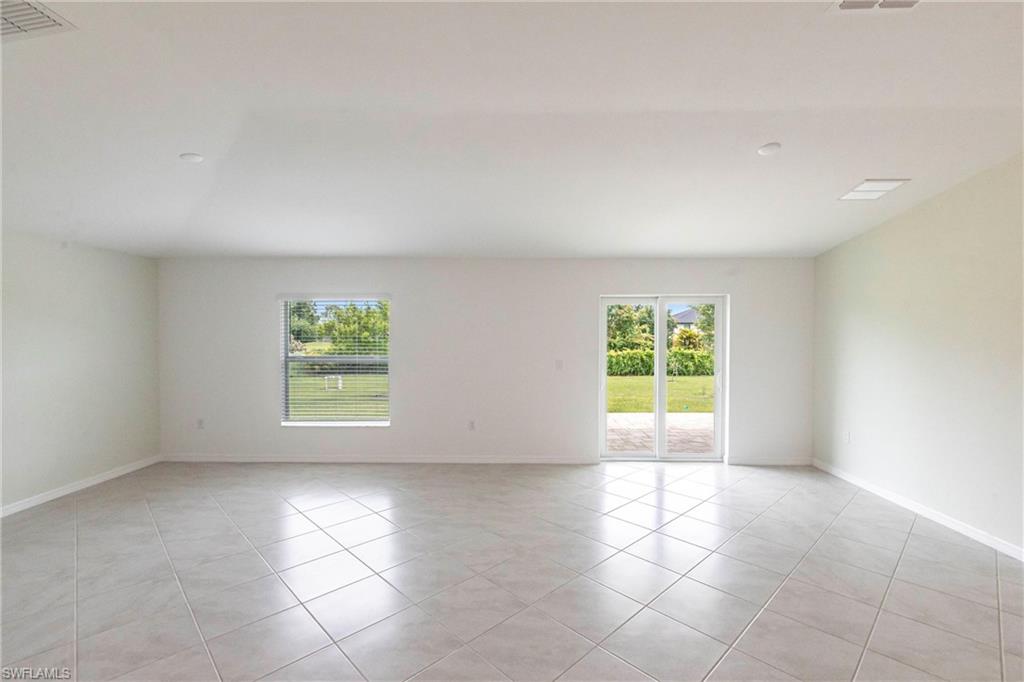 358 Pembroke Street Lehigh Acres, FL 33974 - Photo 3 of 45 a view of an empty room with a window