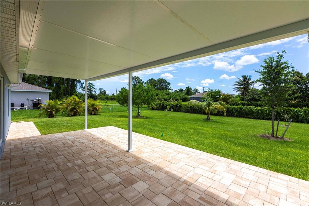 358 Pembroke Street Lehigh Acres, FL 33974 - Photo 33 of 45 a view of a house with a big yard
