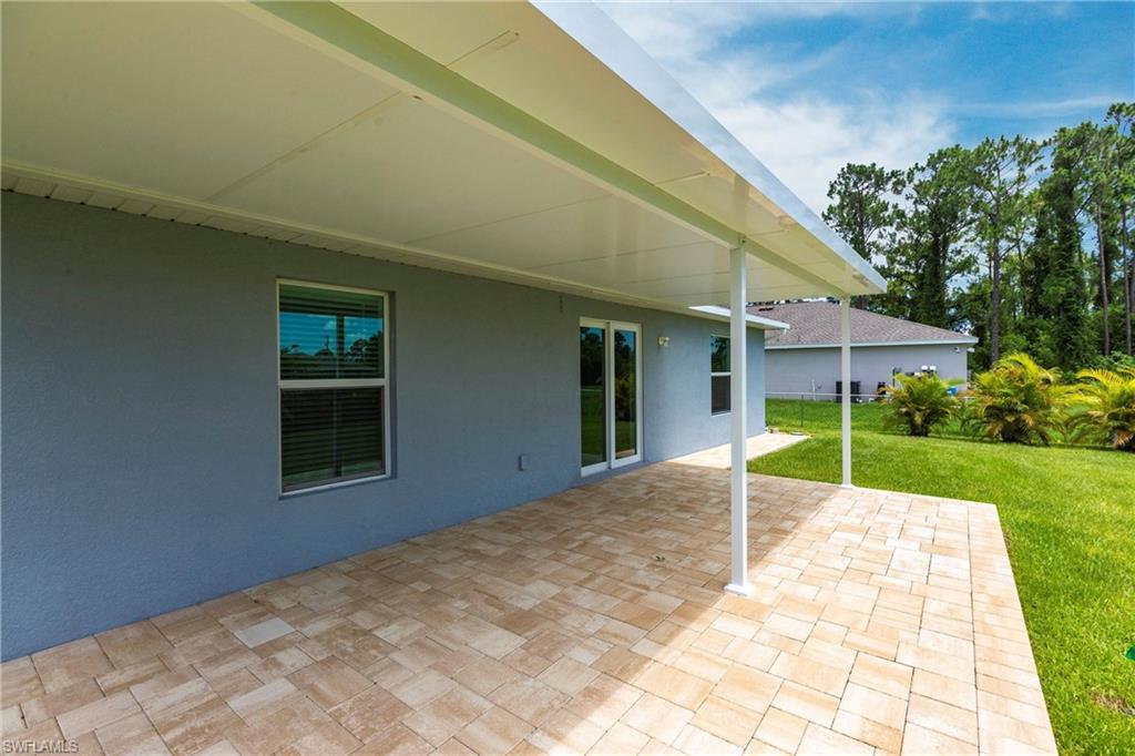 358 Pembroke Street Lehigh Acres, FL 33974 - Photo 34 of 45 a view of a house with a yard