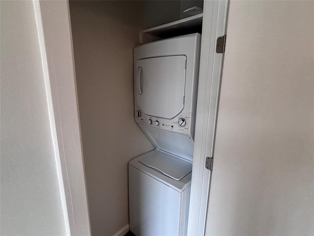 4300 Congress Avenue, Unit 216 Dallas, TX 75219 - Photo 11 of 13 a utility room with dryer and washer