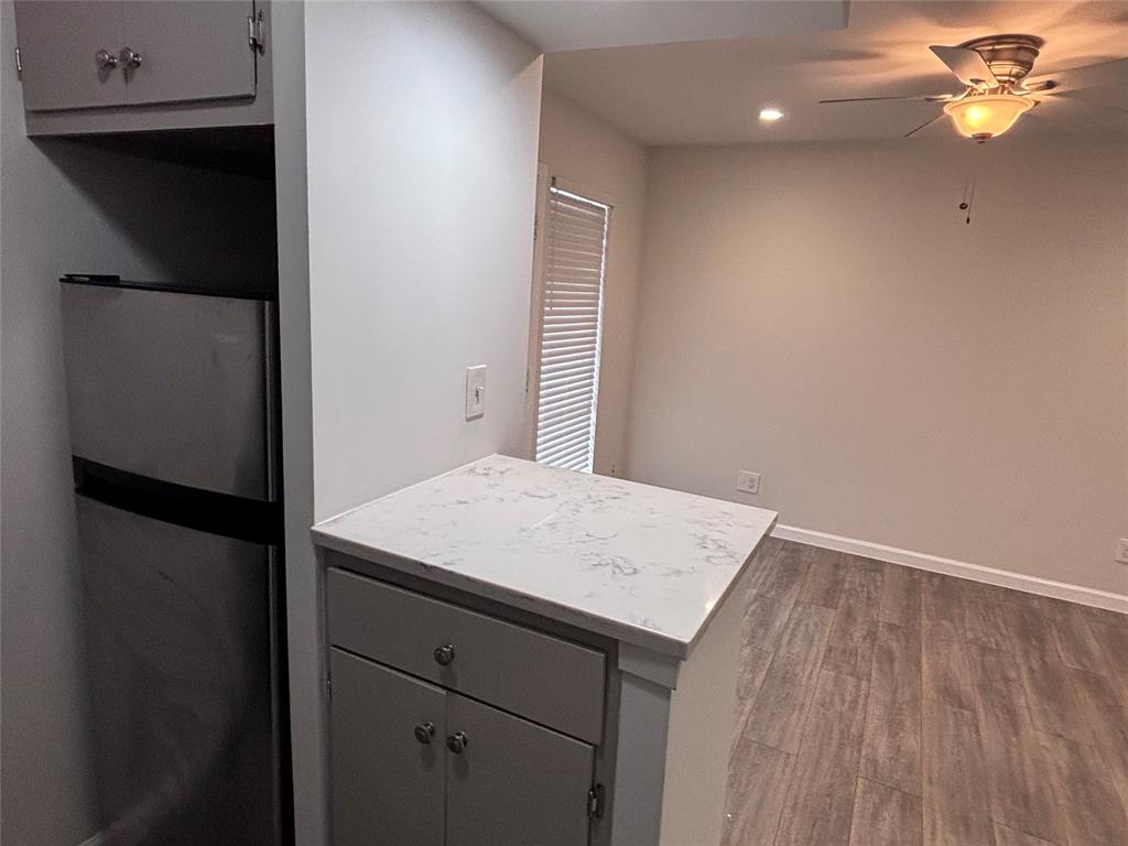 4300 Congress Avenue, Unit 216 Dallas, TX 75219 - Photo 5 of 13 a view of kitchen cabinets